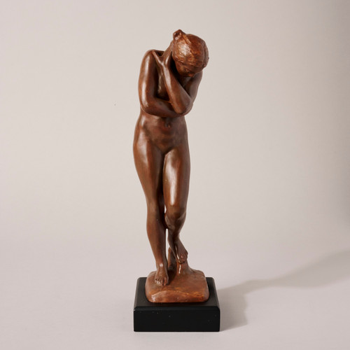Front facing image of the sculpture of Eve on a black pedestal.