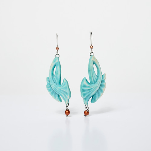 Pair of trumpet-shaped light blue ceramic earrings with single tiny metallic bead hanging below