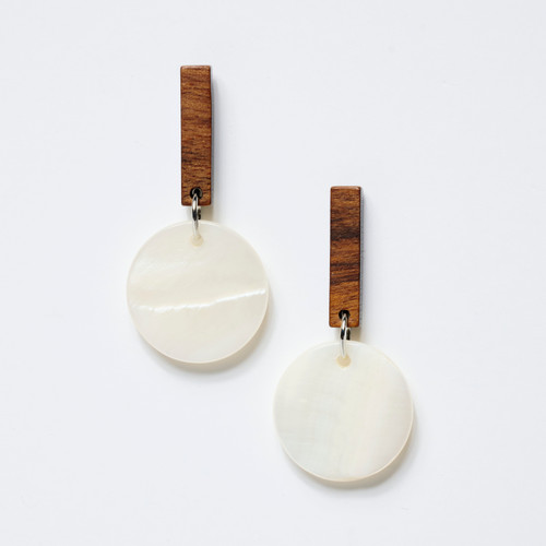 Pair of earrings featuring mother-of-pearl disks suspended by small vertical bars made of wood