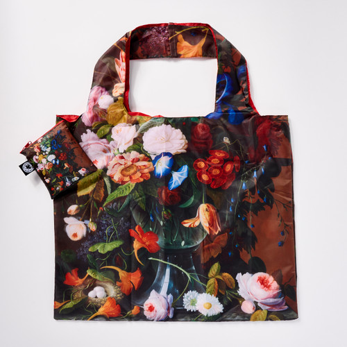 Front view of a reusable tote bag with a full-bleed design of Roesen’s “Flower Still Life with Bird's Nest” painting and a matching square zip pouch.