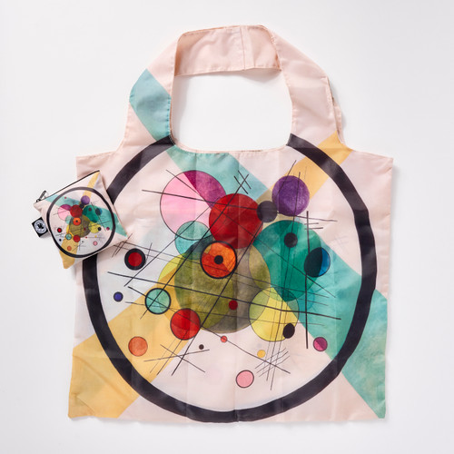 Front view of a reusable tote bag with a full-bleed design of Wassily Kandinsky’s “Circles in a Circle" painting and a matching square zip pouch.