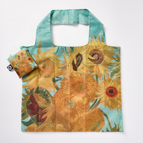 Front view of a reusable tote bag with a full-bleed design of Vincent van Gogh’s “Sunflowers" painting and a matching square zip pouch.