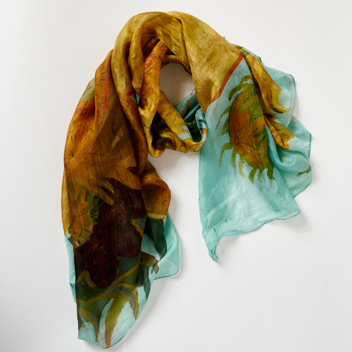Top down view of a silk scarf with full-bleed Sunflowers by Vincent Van Gogh print, arranged in a soft loop.
