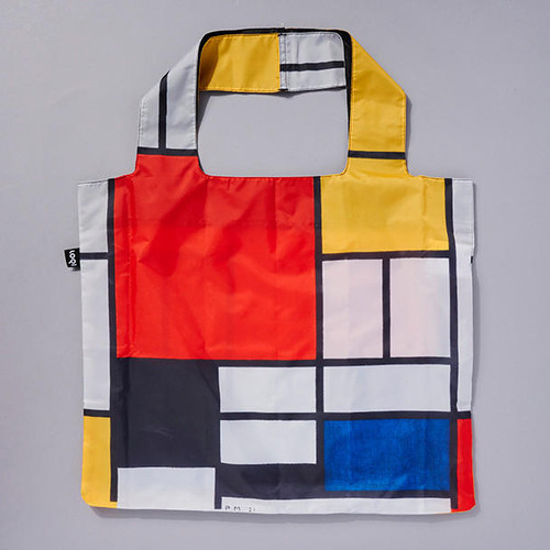 Mondrian Folding Tote, primary colors with black, white and straight lines, fully open and lying flat.