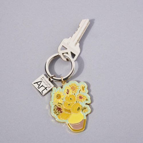 Enamel painted van Gogh Sunflowers image die cut on keychain with key ring and small square name plate. Key on ring to show usage.