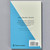 The back cover of Art Essentials: Impressionism shows a blurb about the book in bold, black text on a background that is split into two triangles, one gray and the other blue.