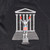 A hand-screened dark grey cotton and polyester sweatshirt depicts a boxer standing on a plinth, arms raised, in front of the museum facade and steps. The boxer image is in light greys and reds. The sweatshirt has a crew neck and raglan sleeves, its cuffs and waistband are ribbed. This close up detail features the boxer image only.