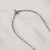 The antiqued gold filled metal chain is pictured here. The lobster clasp is shown closed.