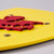 Close-up, side shot of a portion of the yellow shield and red dragon showing the dragon is a separate layer of wood.