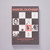 A cover of an A5 blank-paged notebook shows an exhibition poster from the 1973 Marcel Duchamp exhibition held at the Philadelphia Museum of Art. A black and white chessboard motif is superimposed with images of Duchamp works and photos.  The exhibition  name and dates are in red above and below the chessboard.