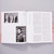 A spread of About Face: Stonewall, Revolt, and New Queer Art shows two black and white photographs on the left page. The top photograph shows three Black women wearing suits and prize sashes for Mr. Lesbian Daveyton 2013. The bottom photograph shows a photograph of a Black woman wearing a sweatervest and button-up shirt with the sleeves rolled up.