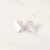 A pair of small, silver stud earrings shaped like a slightly folded piece of paper.