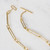 Detail of gold tone brass link necklace toggle style clasp