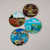 Image of four coasters with four different Monet images featured.