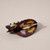 Back of Dark brown with small lavender flowers printed on semi circle shaped hair claw showing spring closure