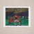 A postcard shows a painting of a man sitting on a park bench on a wooded path.