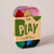 Front facing image of the packaged colorful tin of playing cards.
