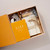 Image shows the Blok Parti Stationery Kit opened and the contents inside the box.