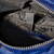 Detail showing grey zipper and grey interior and interior pockets of Canfield Nylon Backpack in medium blue