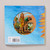 The back cover of Sunflower Seeds shows a blue field with a circular cutout showing two children in a garden.