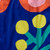 Detail image of Blossom cobalt blue background with orange, yellow and green flower graphics Convertible Backpack Tote by Notabag