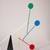 Close-up of small red, blue, yellow, and green circles.