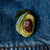 Realistic looking Embroidered & Beaded Avocado Pin shown on denim jacket