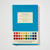 Front cover of Werners Nomenclature of Colours, a blue book with a rainbow spectrum of color swatches at the bottom.
