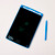 Aerial view of the tablet with a flower drawn on it, lying flat and drawing stick lying adjacent.