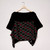 Primarily black top on hanger; top portion solid black with patterned section below featuring horizontal waves of red with white detail