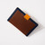 Back side Brown leather passport wallet with dark blue frame border and mustard-tone snap closure