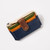 Multicolor wallet with brown snap band over navy, green and yellow orange dividers and zip top