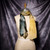 Printed scarf featuring the work of Matta The Bachelors Twenty Years Later wrapped around the neck of a dress form