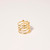 Woven gold-tone wire ring consisting of 4 thin horizontal bands and interlocking basketweave front shown from back