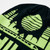 Detail of primarily black beanie style knit hat with lime green Philadelphia skyline on top portion and the word 'PHILADELPHIA' knitted on folded brim in lime green