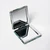 Hinged mirror opened at 45 degree angle on surface