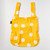 Yellow dot pattern backpack tote opened up and laying flat