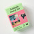 Front view of a pink and green box of matching game cards that have cards with different animals and artworks they're featured in.