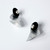 A pair of silver cone-shaped studs with black and silver accents.