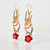 Close-up of the earrings with one earring in focus to show more detail.
