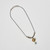 Full view of the necklace laid flat.