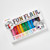 Top-down view of a pack of 12 bright markers arranged in rainbow order.