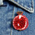 Embroidered and Beaded Pomegranate Pin shown pinned to denim jacket