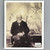 The back cover of Cézanne from the Basic Art series shows a photograph of the painted seated in front of a canvas with a painting of a group of nude women under a tree.