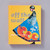 The cover of Off the Wall: American Art to Wear depicts a figure wearing a cape and bonnet in front of a yellow background. The quilted cape shows a group of planes flying into the sky and the bonnet shows the moon. The title is overlaid over the figure.