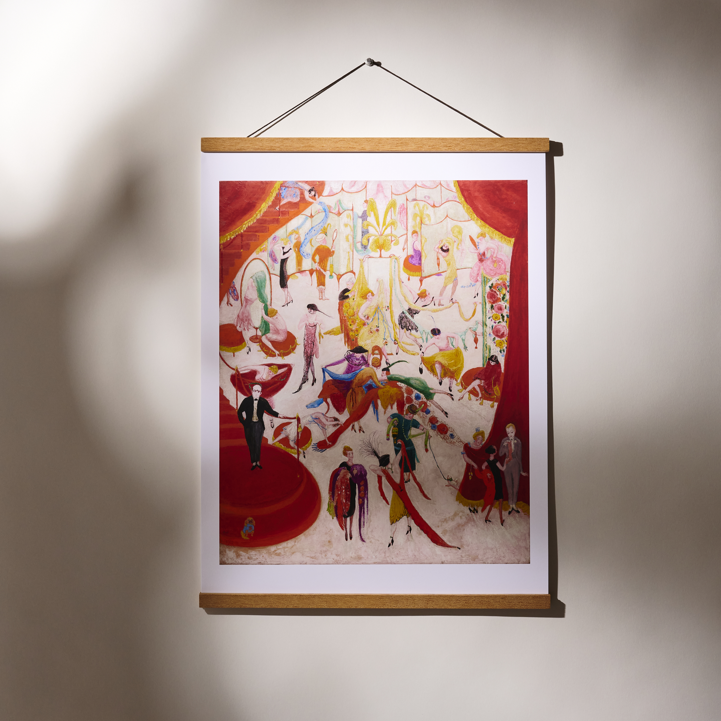 A floral poster hanging on a wall with a wooden frame.
