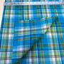 STARFRUIT Madras 100% cotton, Width 60 inches (150 cm), Per Half-Meter - Elegante Virgule Canada, Canadian Fabric Quilt Shop, A plaid made of shades of Blue, Green and Yellow with Black and White stripes