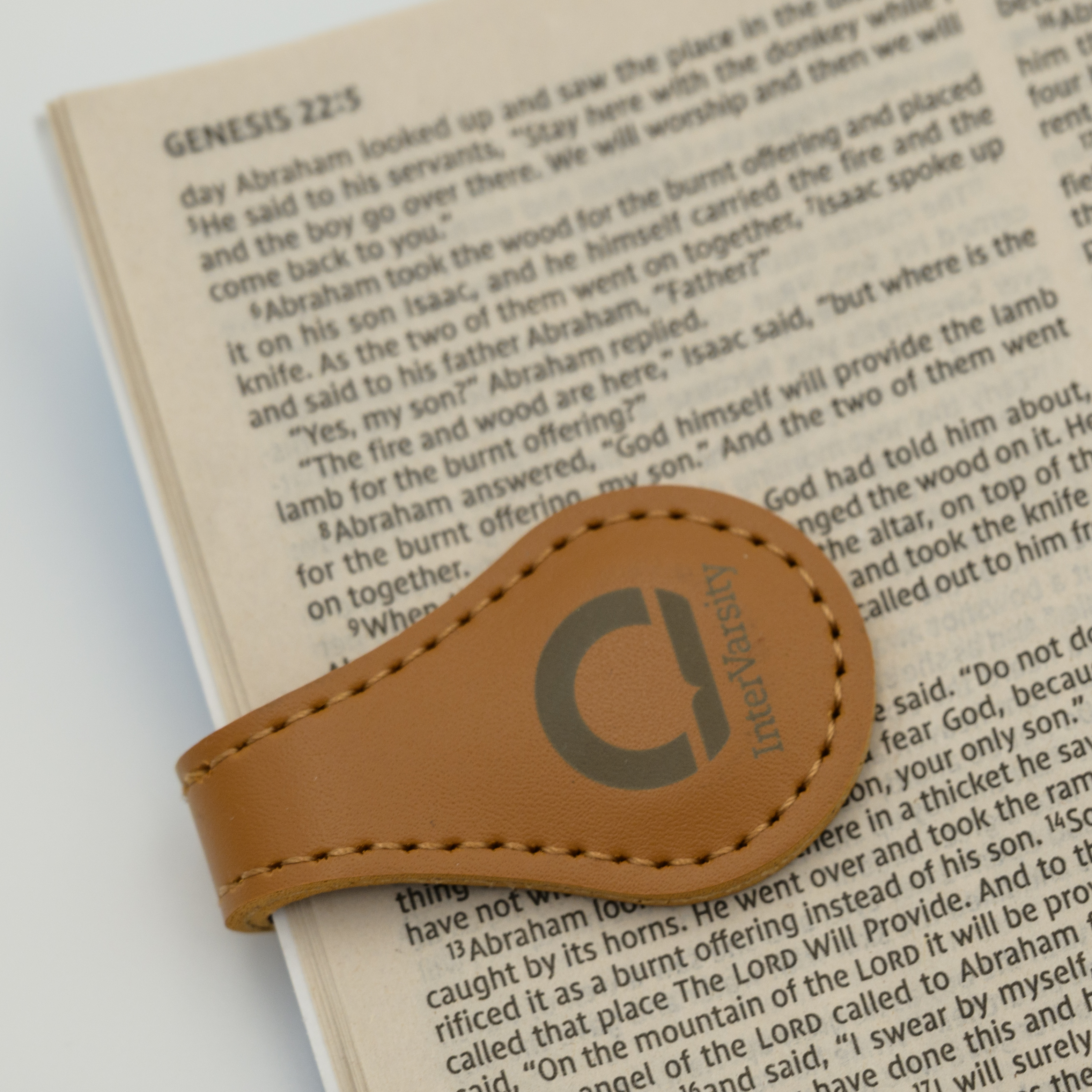 Magnetic Bookmark with InterVarsity branding.  Bookmark is faux leather material. Bible not included.