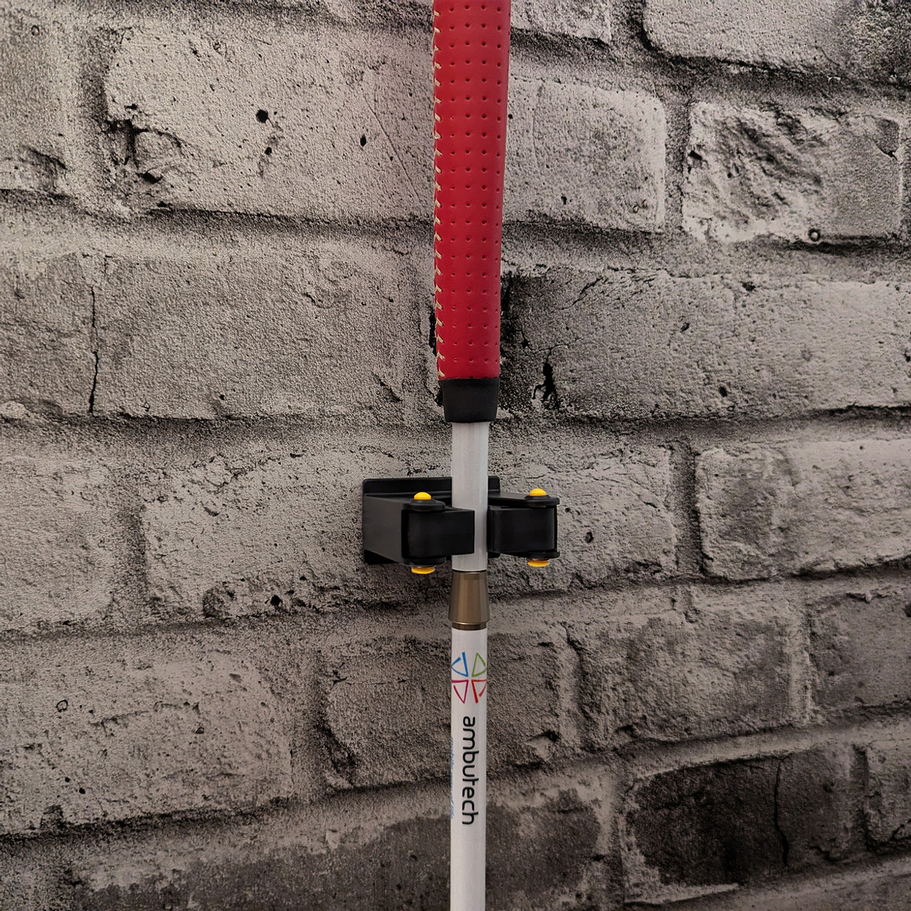 Image: Ambutech grippit cane holder on a brick wall