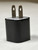 image: square wall plug for a USB-A charging cable, upright
